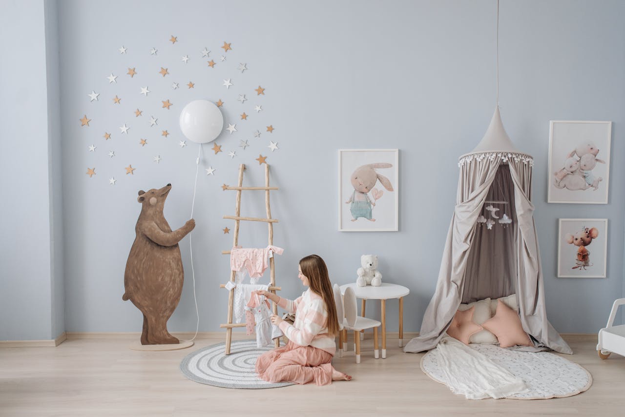 Crafting Captivating Headlines: Your awesome post title goes here Woman arranging baby clothes in a beautifully decorated nursery with playful decor.